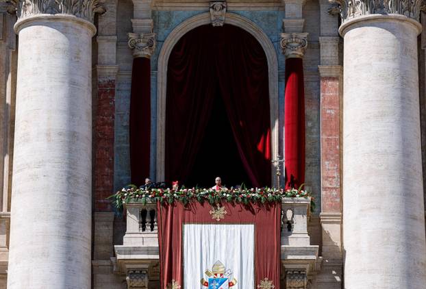 Pope Leo XIV delivers his "Urbi et Orbi" (To the city and the world) message from the main balcony of St. Peter's Basilica