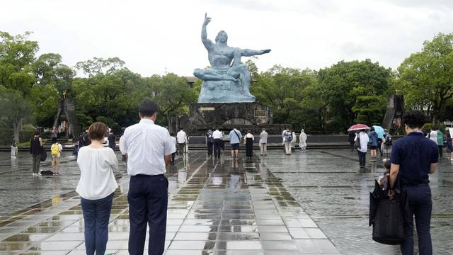 People offer silent prayers for the victims of the 1945 atomic bombing to mark the 78th anniversary of the bombing in Nagasaki