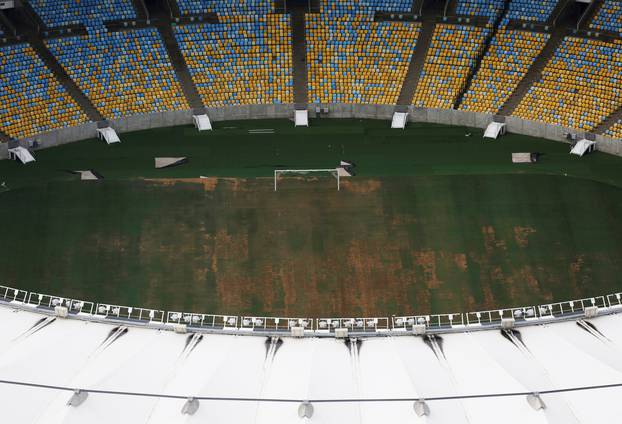An aerial view of Maracana Stadium shows the turf being dry, worn and filled with ruts and holes, in Rio de Janeiro