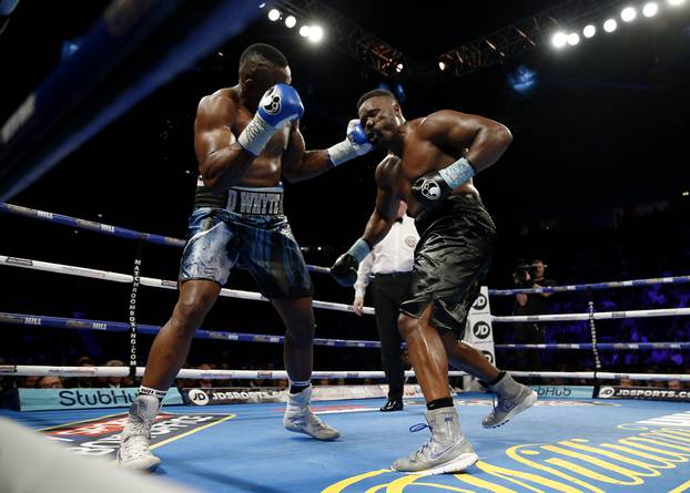 Dereck Chisora in action against Dillian Whyte (L)