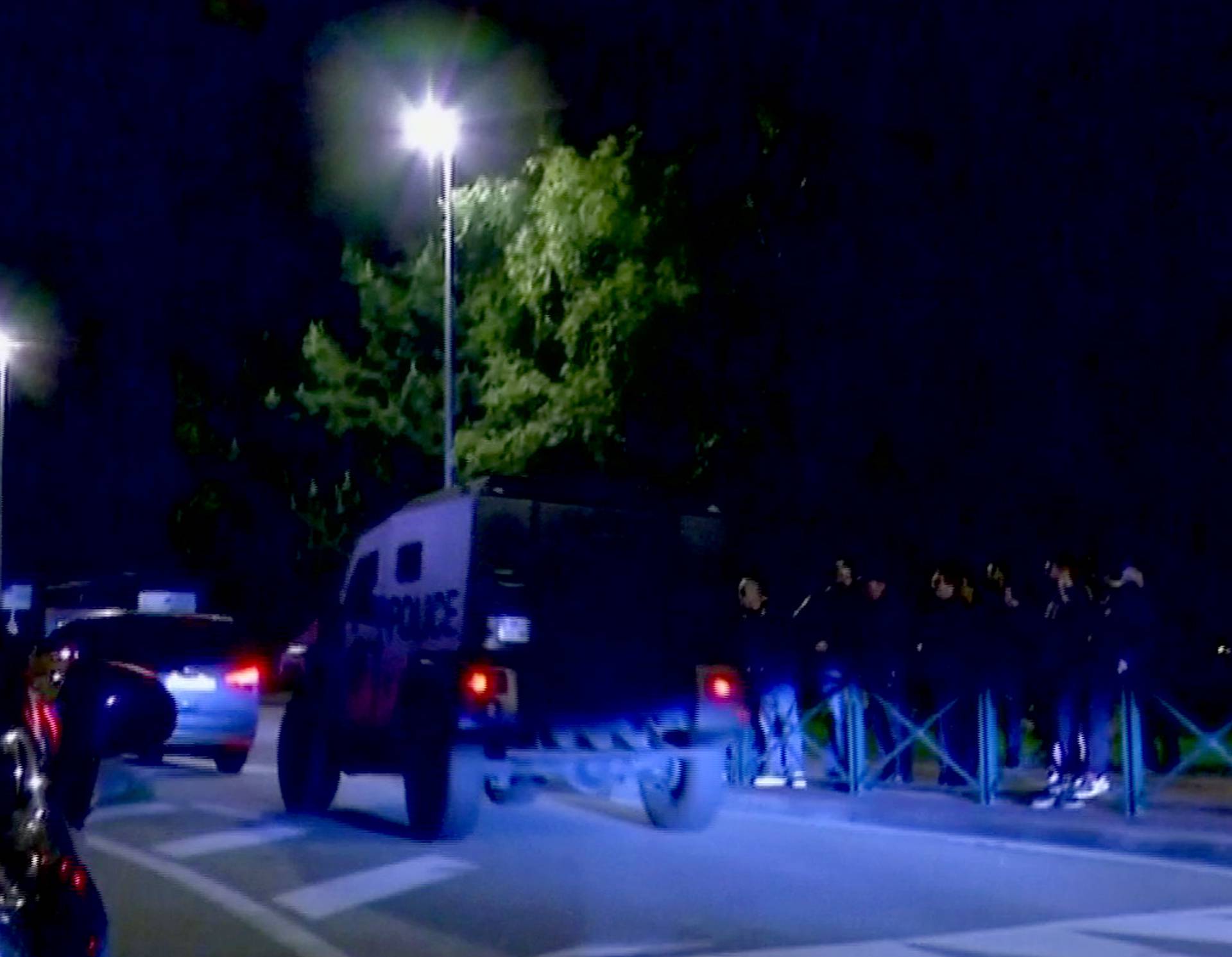 Police vehicles at the scene where a French police commander was stabbed to death in front of his home in the Paris suburb of Magnanville