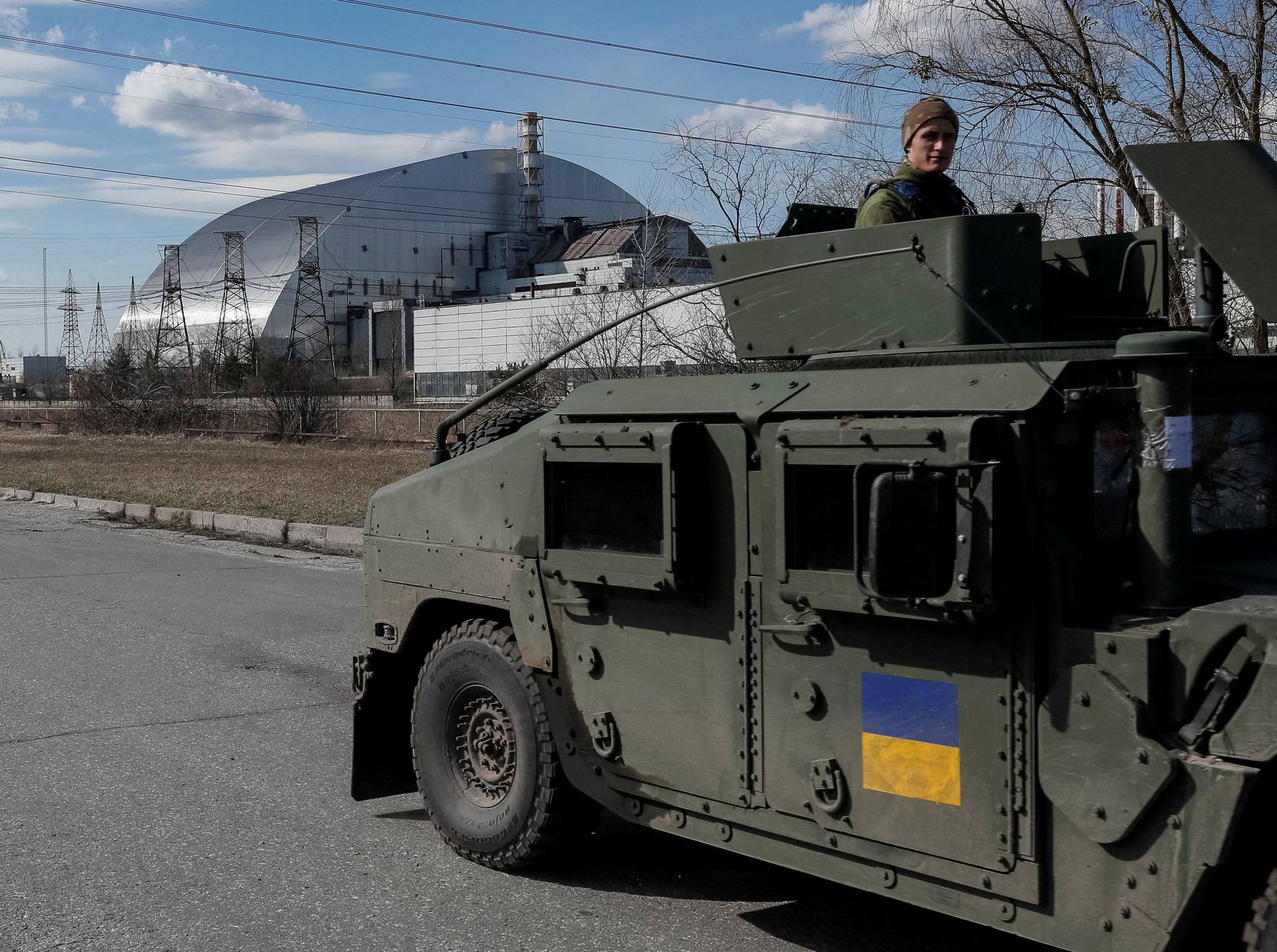 Servicemen of Ukrainian National Guard patrol area near the Chernobyl Nuclear Power Plant, in Chernobyl