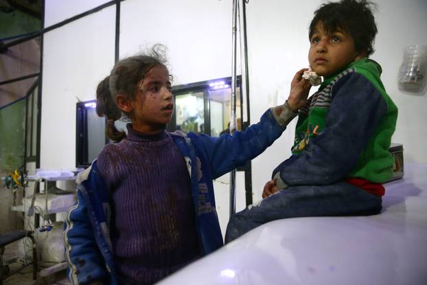 Wounded children are seen in a hospital in the besieged town of Douma, Eastern Ghouta, Damascus