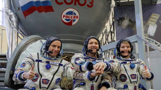 Crew members of the International Space Station (ISS) pose for a picture as they attend the final qualification training for their upcoming space mission in Star City