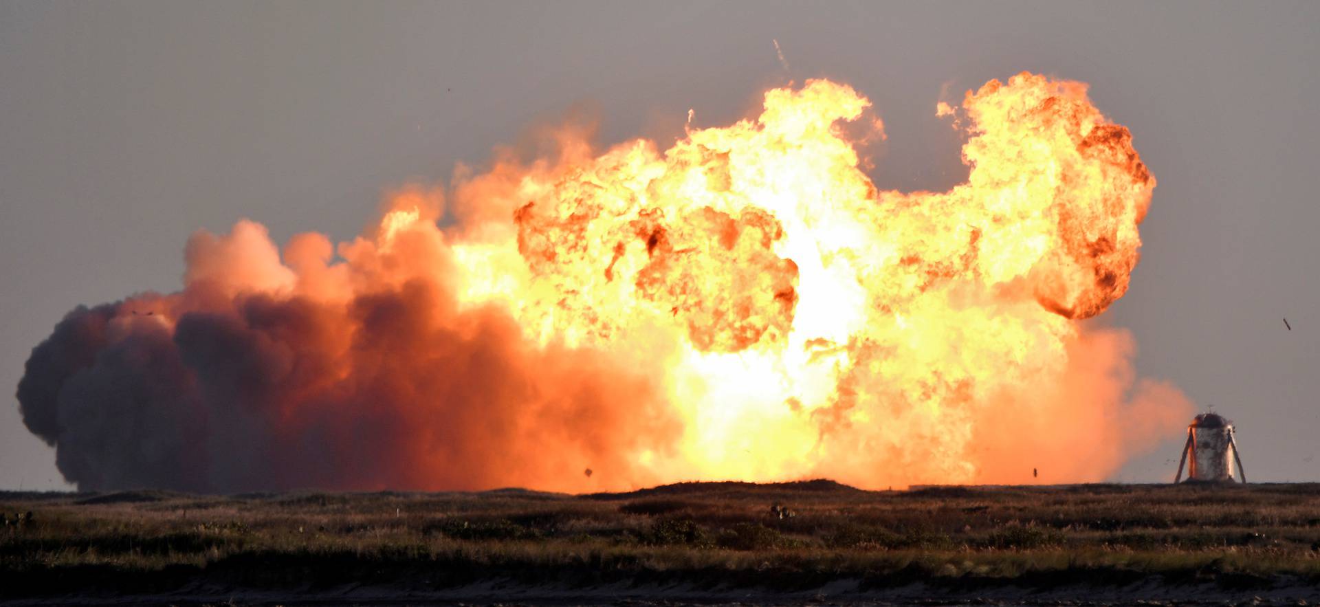 SpaceX's first super heavy-lift Starship SN8 rocket explodes during a return-landing attempt after it launched from their facility on a test flight in Boca Chica, Texas