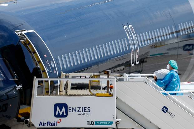 Passengers of the cruise ship MV Hondius, which was affected by a hantavirus outbreak, arrive at Tenerife Sud airport