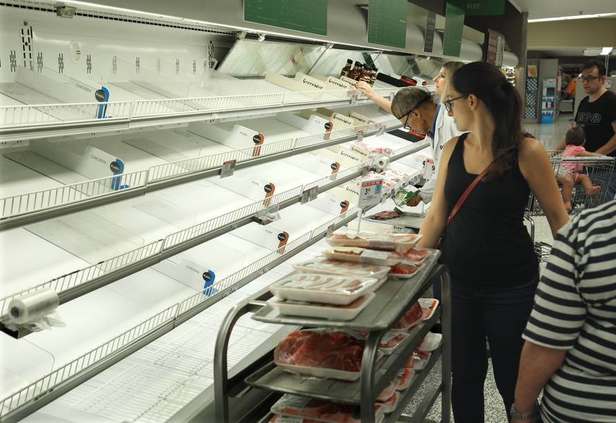 Empty shelves greet shoppers at a supermarket ahead of Hurricane Irma making landfall in Kissimmee
