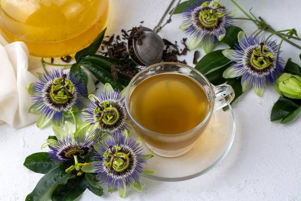 A cup of herbal tea with Passiflora caerulea. Alternative herbal