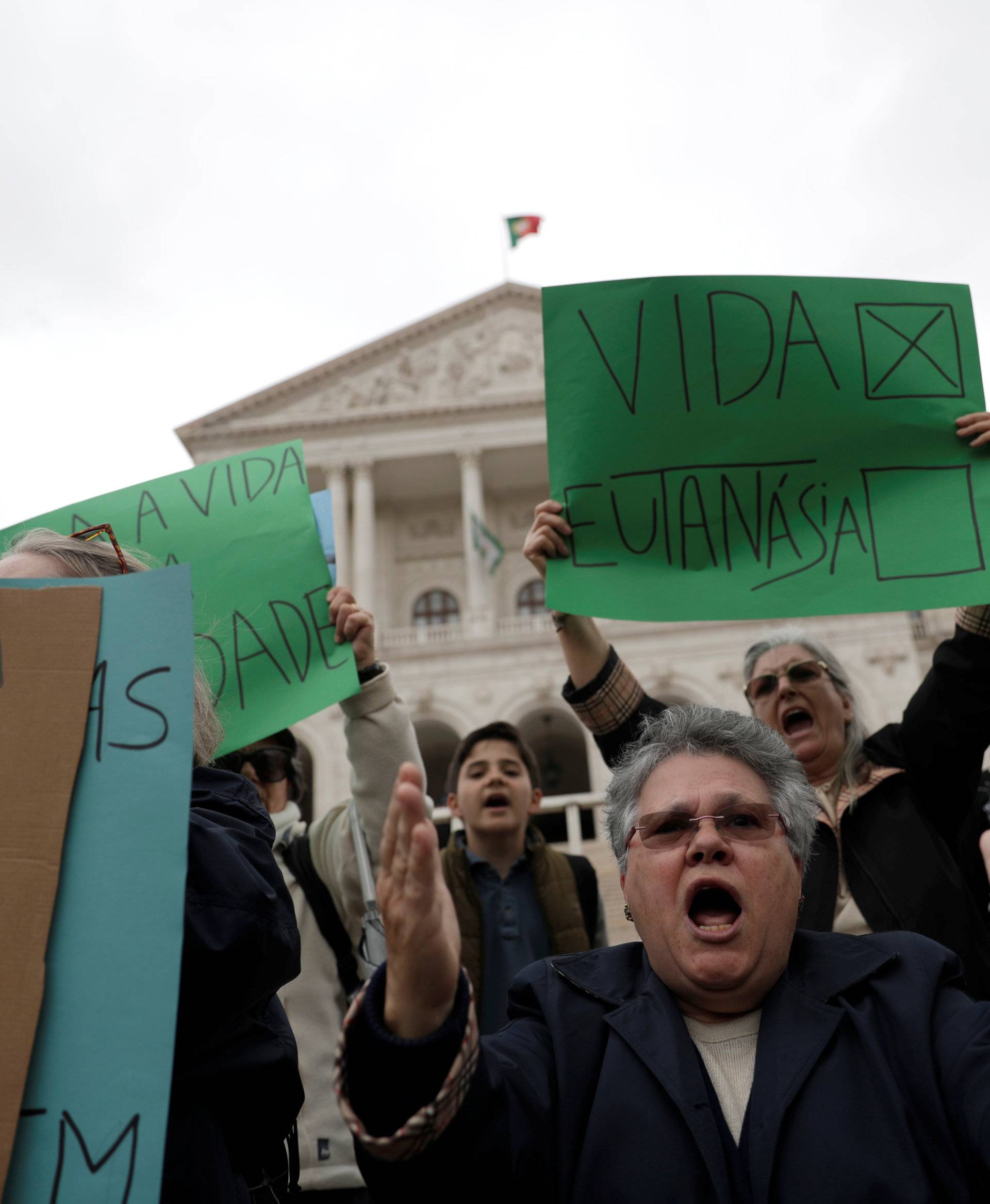 Demonstrators attend a protest against euthanasia in front off the parliament in Lisbon