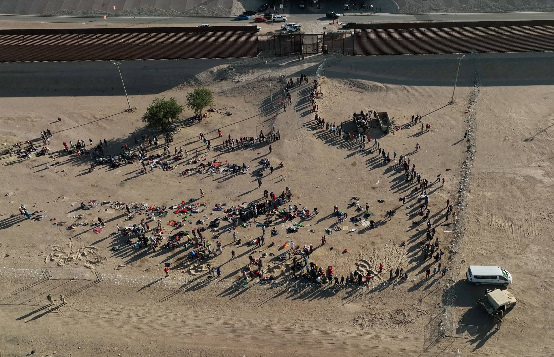 Migrants gather along the U.S.-Mexico border before the lifting of Title 42 near El Paso, Texas
