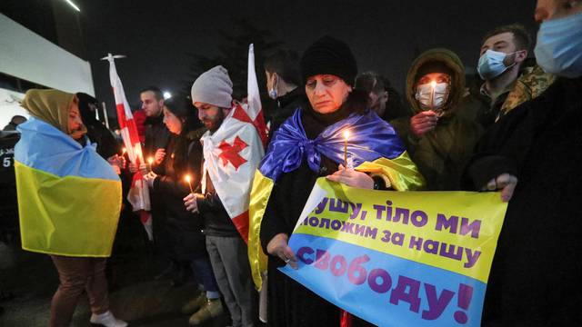 People gather to pay tribute to fallen Georgian military volunteers in Tbilisi