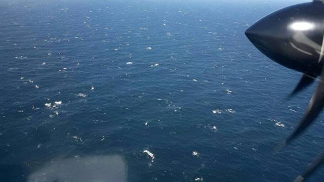 An Argentine Navy airplane is seen as it flies over the Atlantic Ocean during the search for the ARA San Juan submarine missing at sea