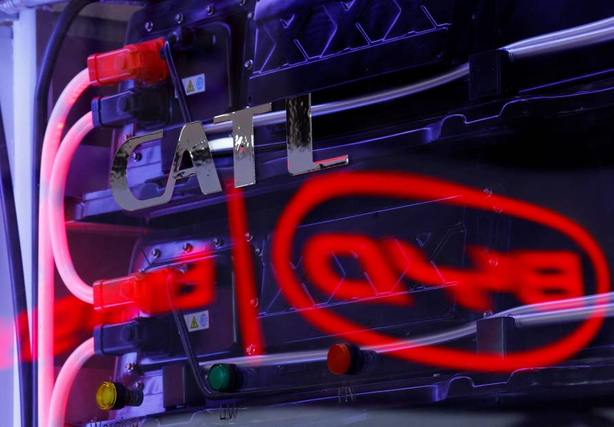 BYD's logo is reflected on CATL's TENER Flex rack energy storage system in Tokyo