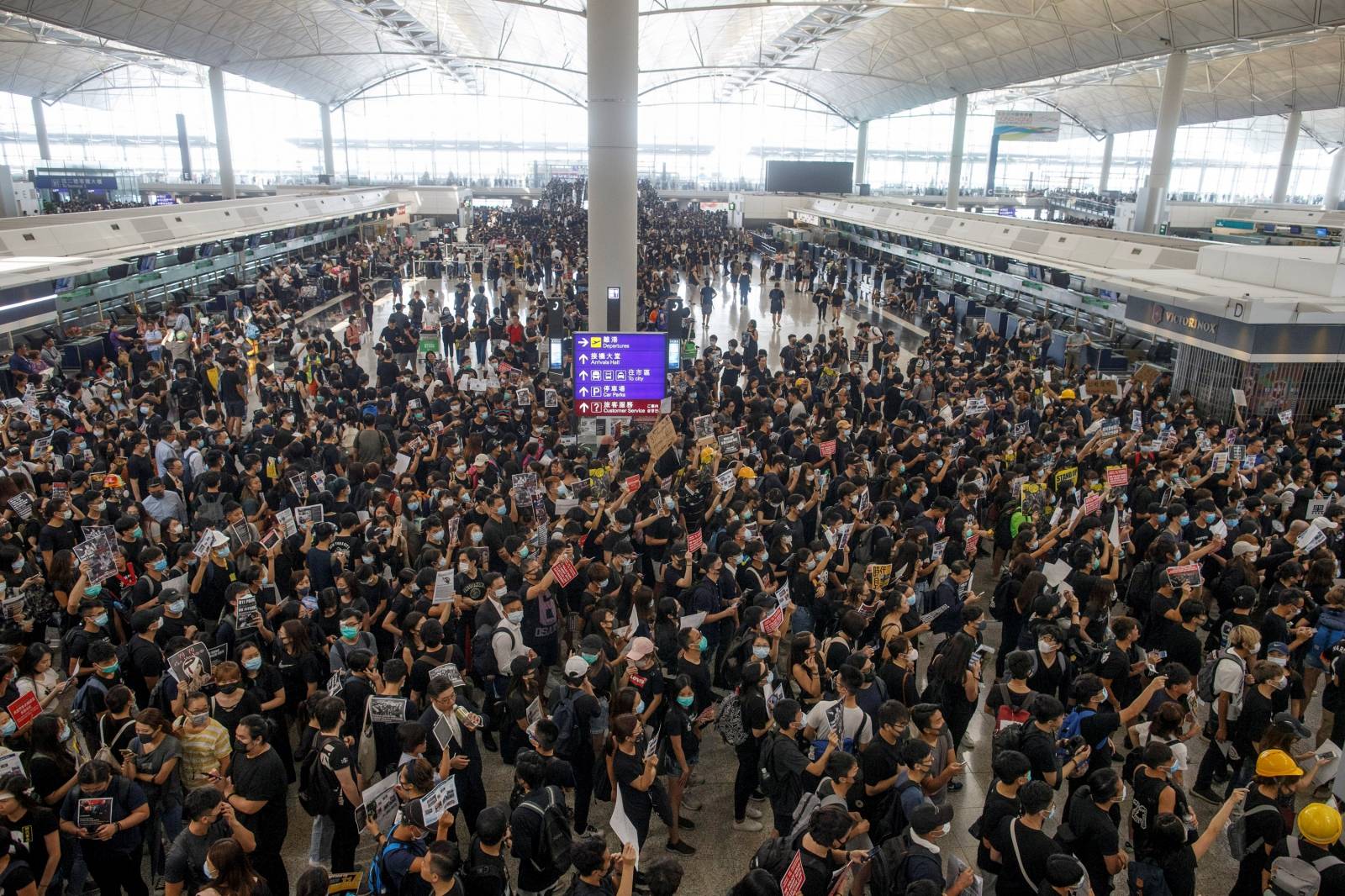 Anti-extradition bill protesters rally at the departure hall of Hong Kong airport in Hong Kong