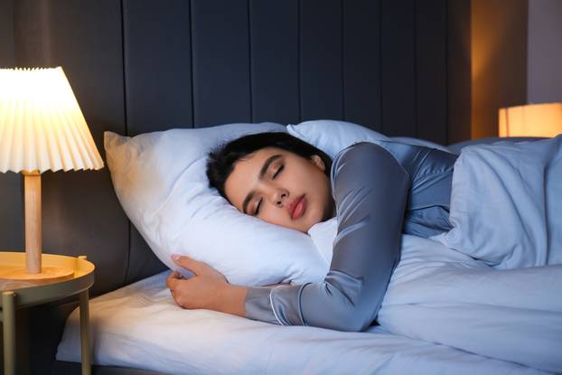 Beautiful,Young,Woman,Sleeping,In,Bedroom,At,Night