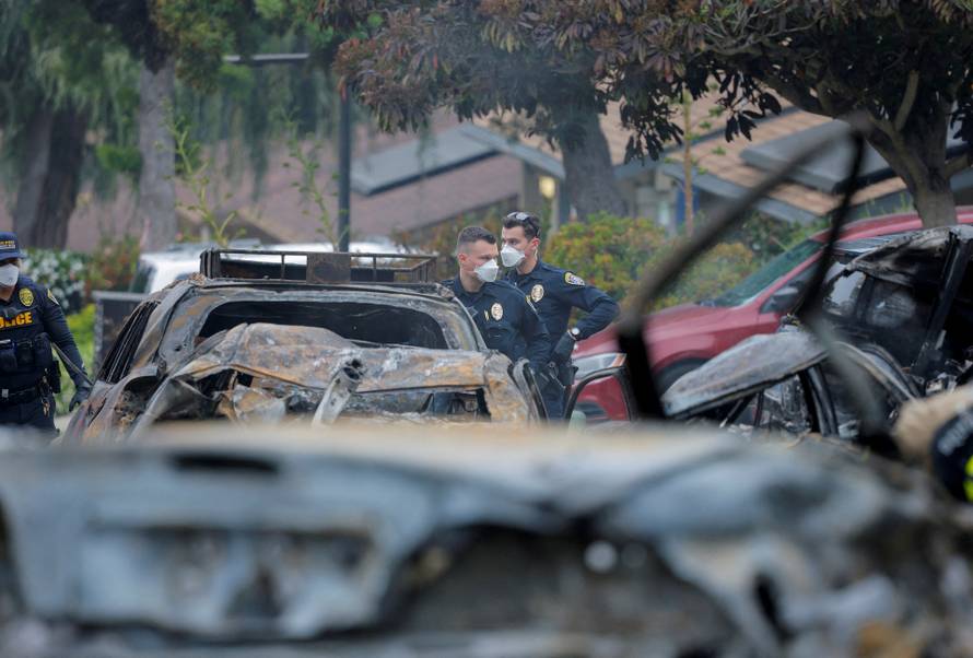 Crash scene after a civilian aircraft went down in a neighborhood, in San Diego