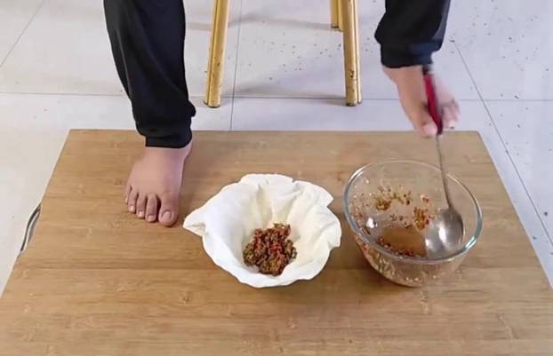 Armless man makes dumplings from scratch using only his feet