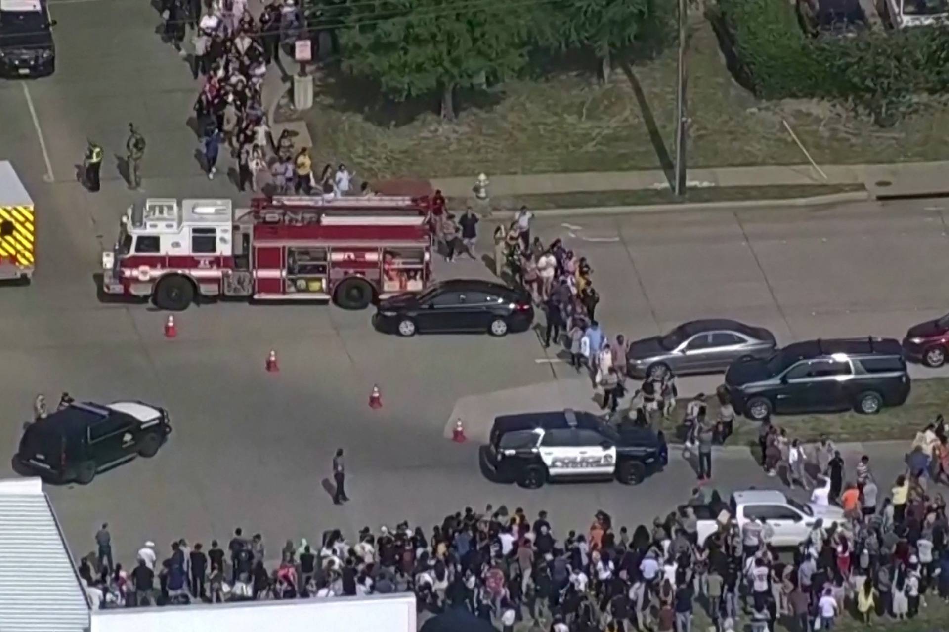 Police respond to a shooting in the Dallas area's Allen Premium Outlets