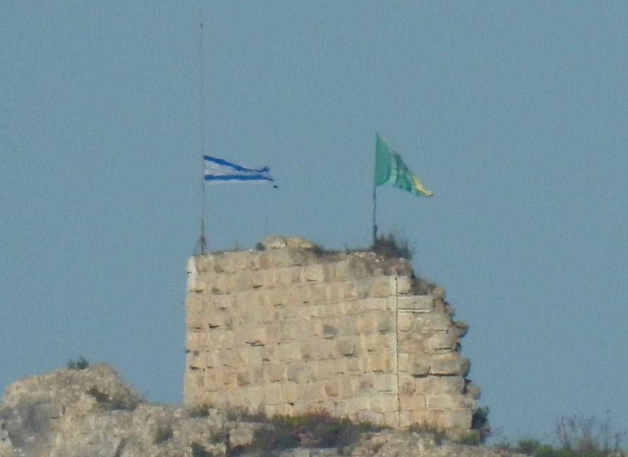 An Israeli flag and a flag of the Golani Brigade are raised on Beaufort Castle, as seen from Marjayoun