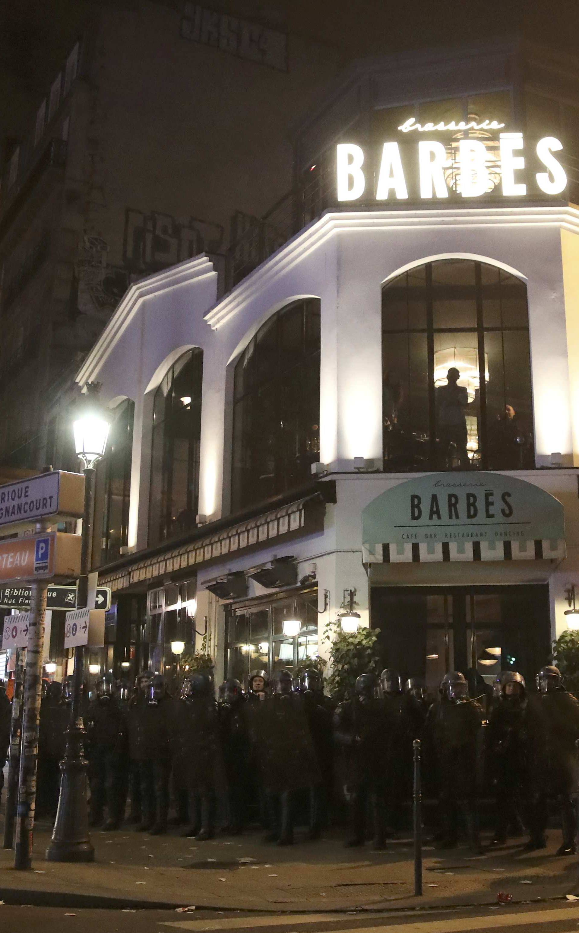  French riot police secure the Barbes brasserie during a protest against police brutality after a young black man, 22-year-old youth worker named Theo, was severly injured during his arrest earlier this month in Bobigny, at a demonstration in Paris
