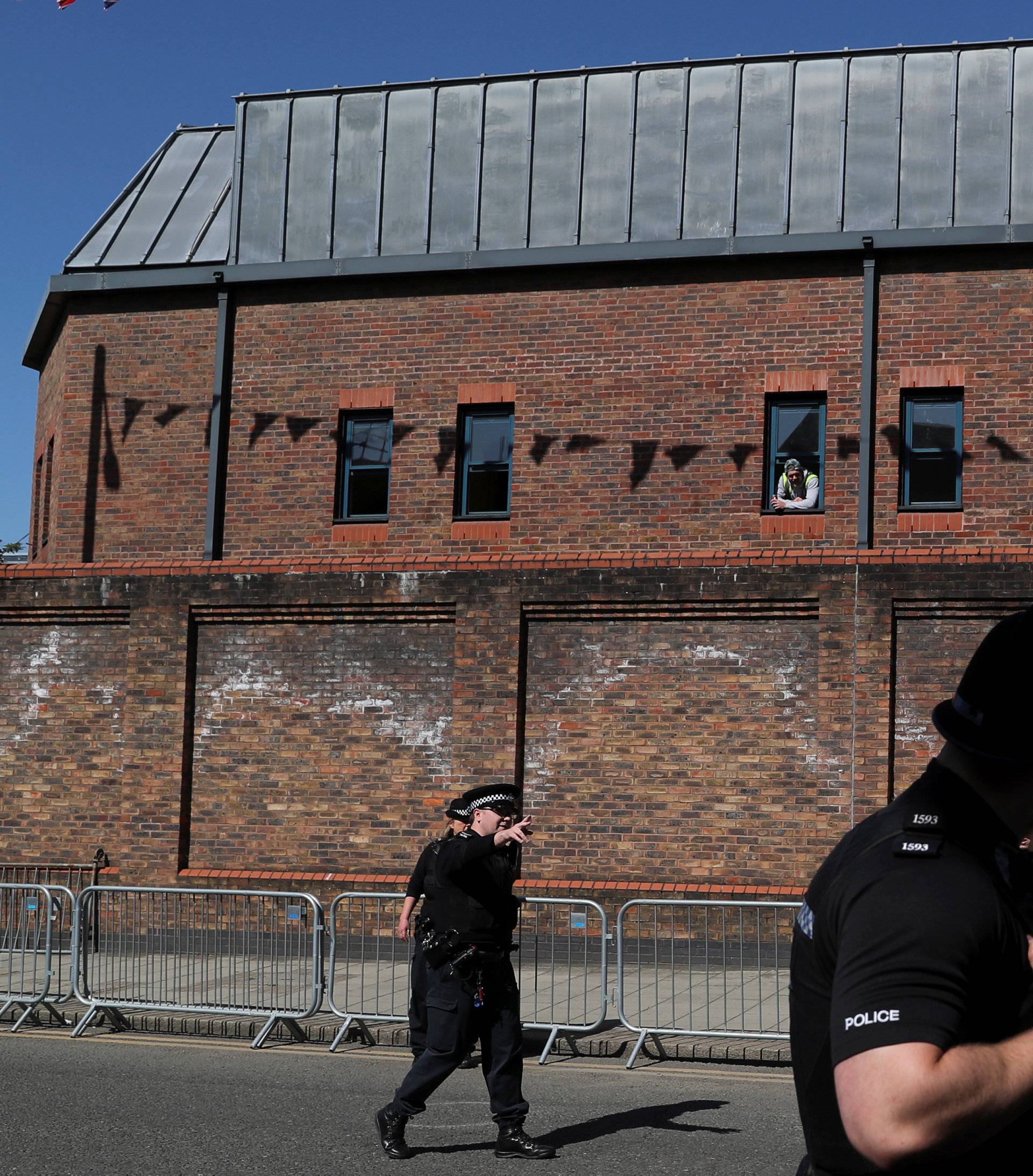 Police officers patrol ahead of the wedding of Britain's Prince Harry and Meghan Markle in Windsor