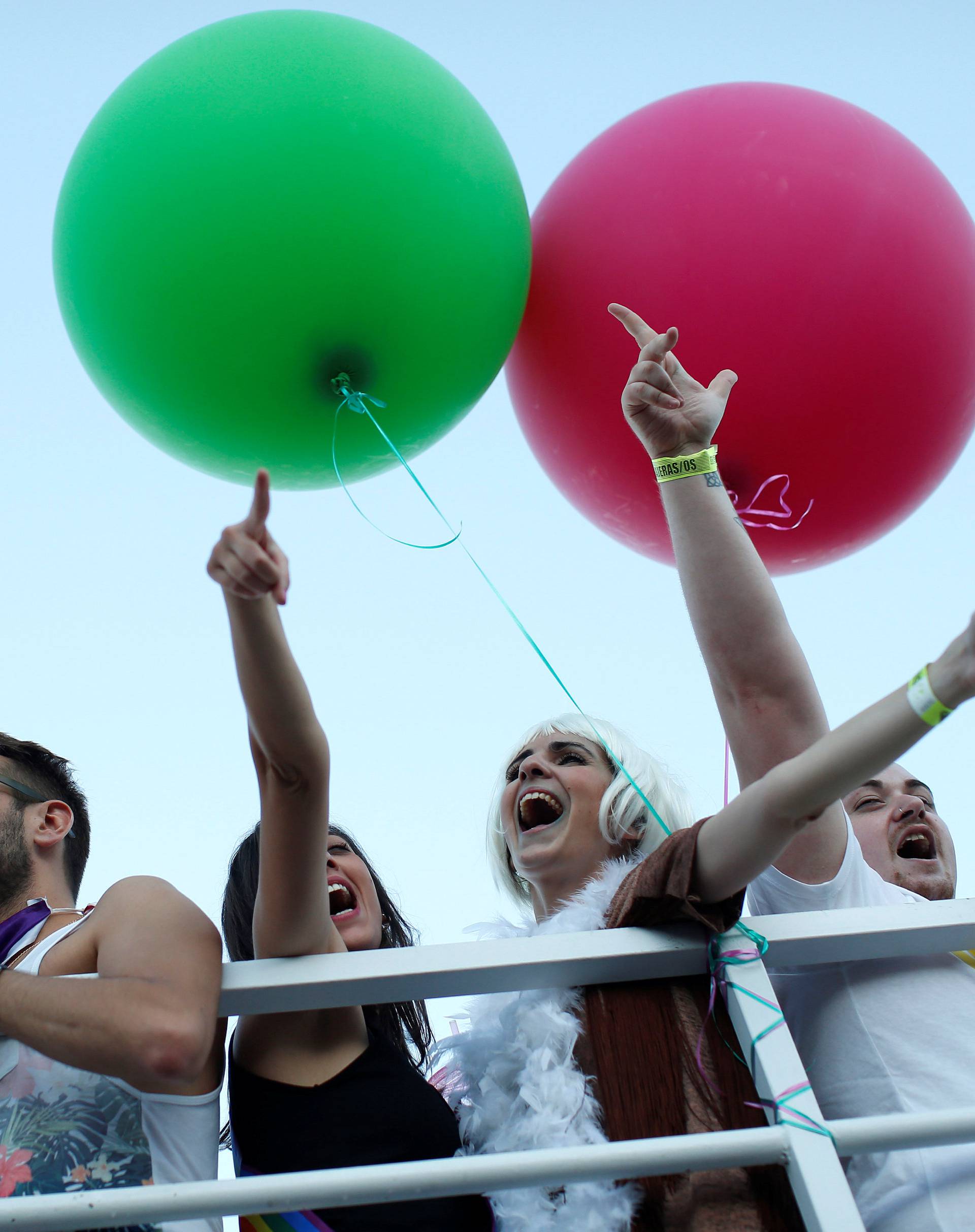 Revellers attend the World Pride parade in Madrid
