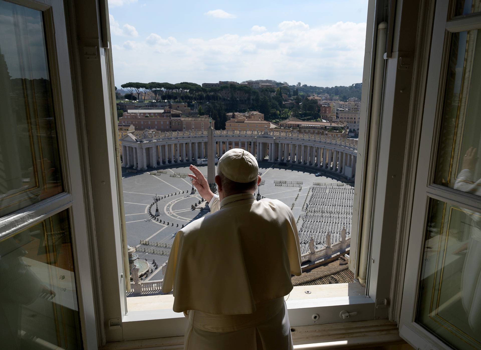 Pope Francis sends a virtual hug after delivering his weekly Angelus prayer via video at the Vatican