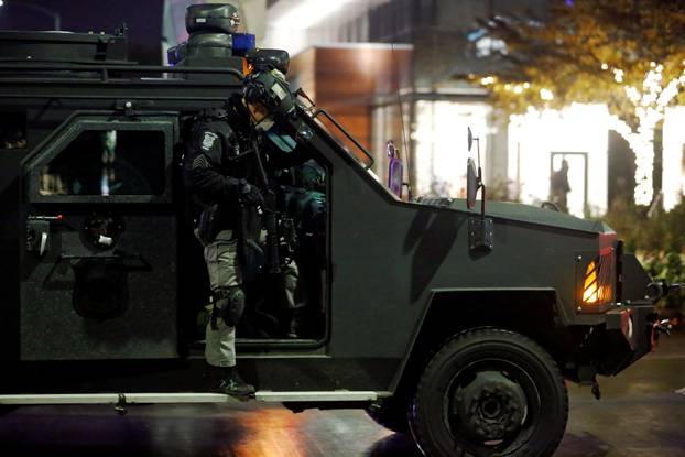 Police officers respond to a protest march that took place on Election Day in Seattle