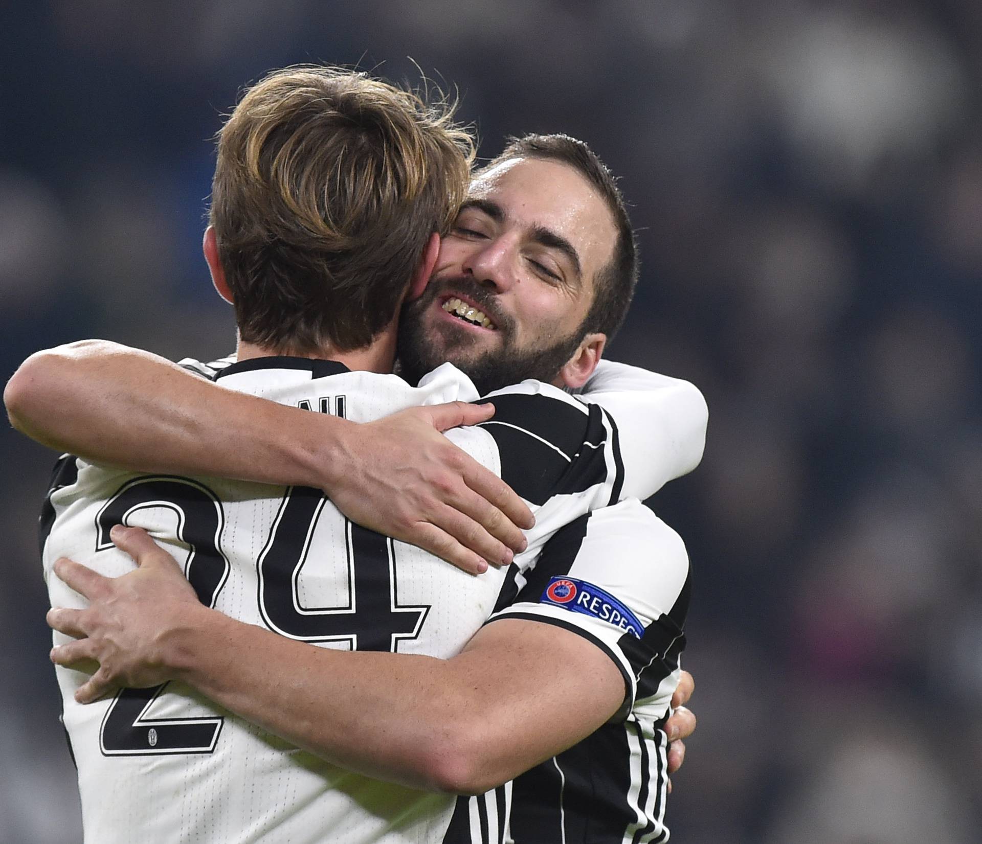 Juventus' Daniele Rugani celebrates scoring their second goal with Gonzalo Higuain