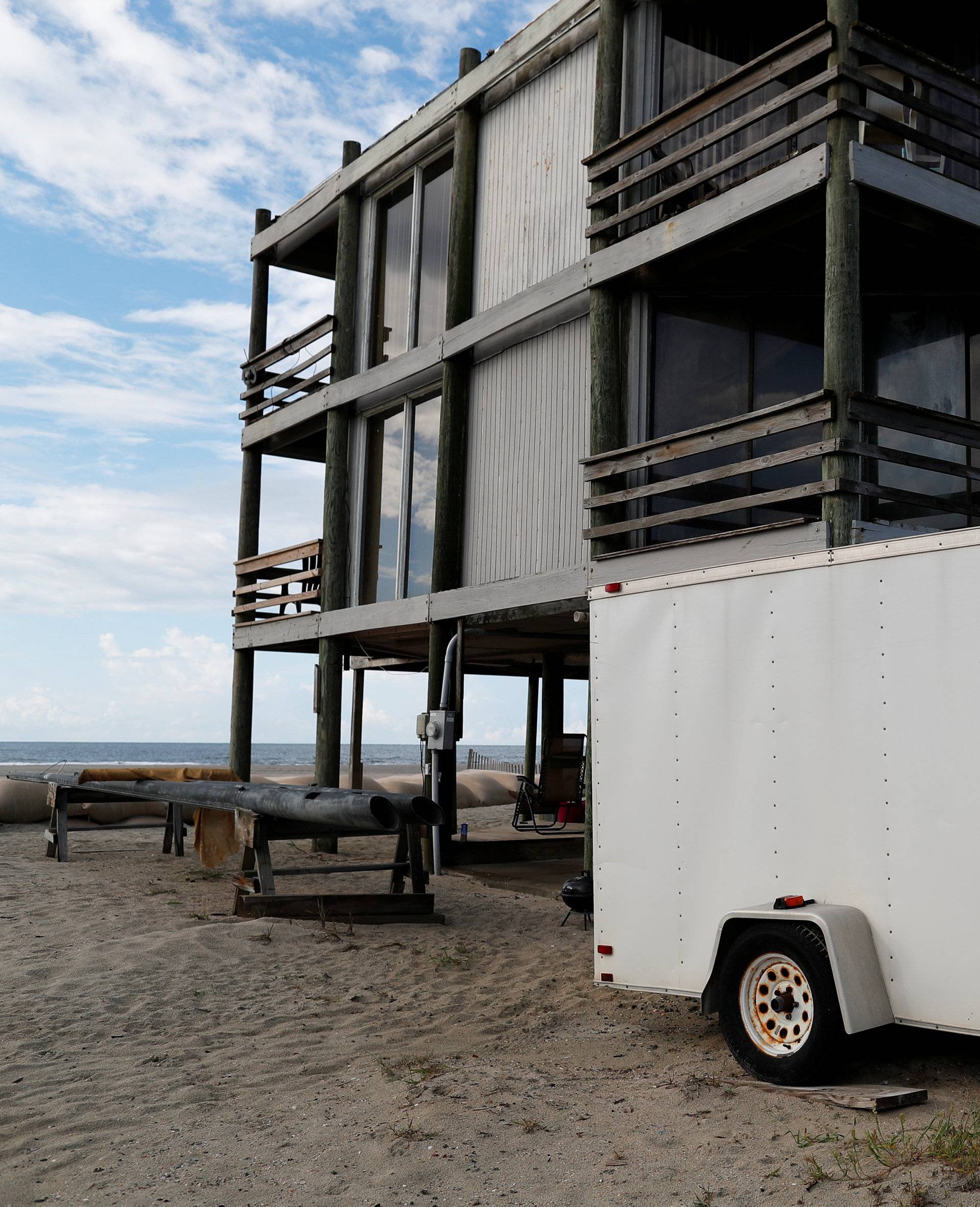 Gordon Roberts works to prepare his oceanfront home ahead of the arrival of Hurricane Florence in Ocean Isle Beach