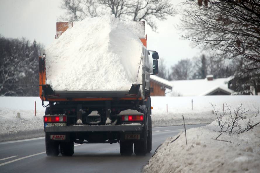 A truck carries snow near Miesbach, southern Germany