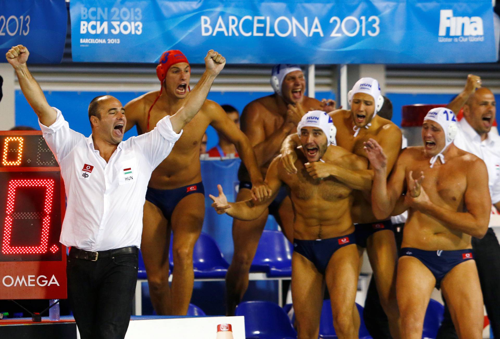 FILE PHOTO: Hungary's head coach Benedek and his players celebrate after winning against Montenegro at their men's water polo gold medal match during the World Swimming Championships in Barcelona