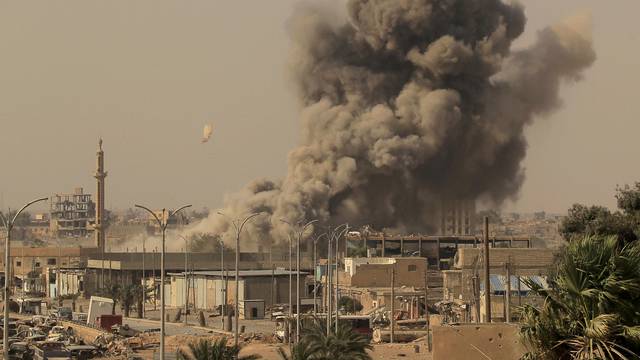 FILE PHOTO: Smoke rises after an air strike during fighting between members of the Syrian Democratic Forces and Islamic State militants in Raqqa