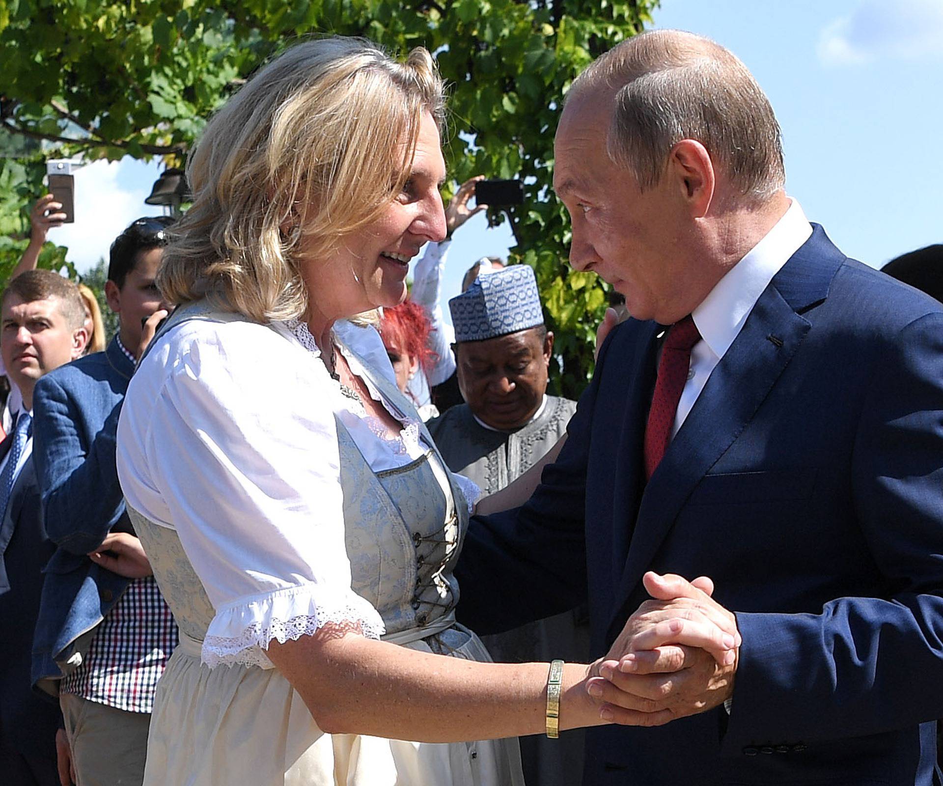 Austria's Foreign Minister Kneissl dances with Russia's President Putin at her wedding in Gamlitz