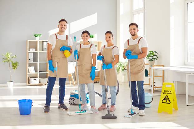 Portrait,Of,Happy,Smiling,Team,Of,Young,Janitors,In,Uniform