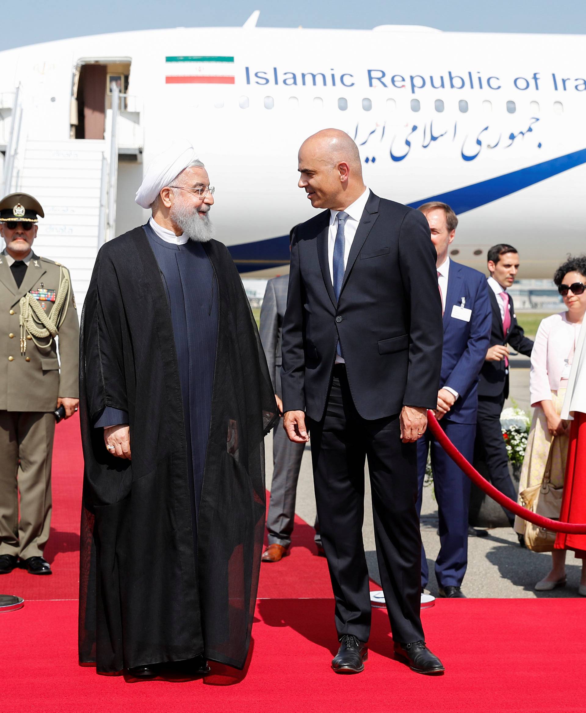 Swiss Federal President Alain Berset, welcomes Iranian President Hassan Rohani during his visit to Switzerland at the Zurich airport in Kloten