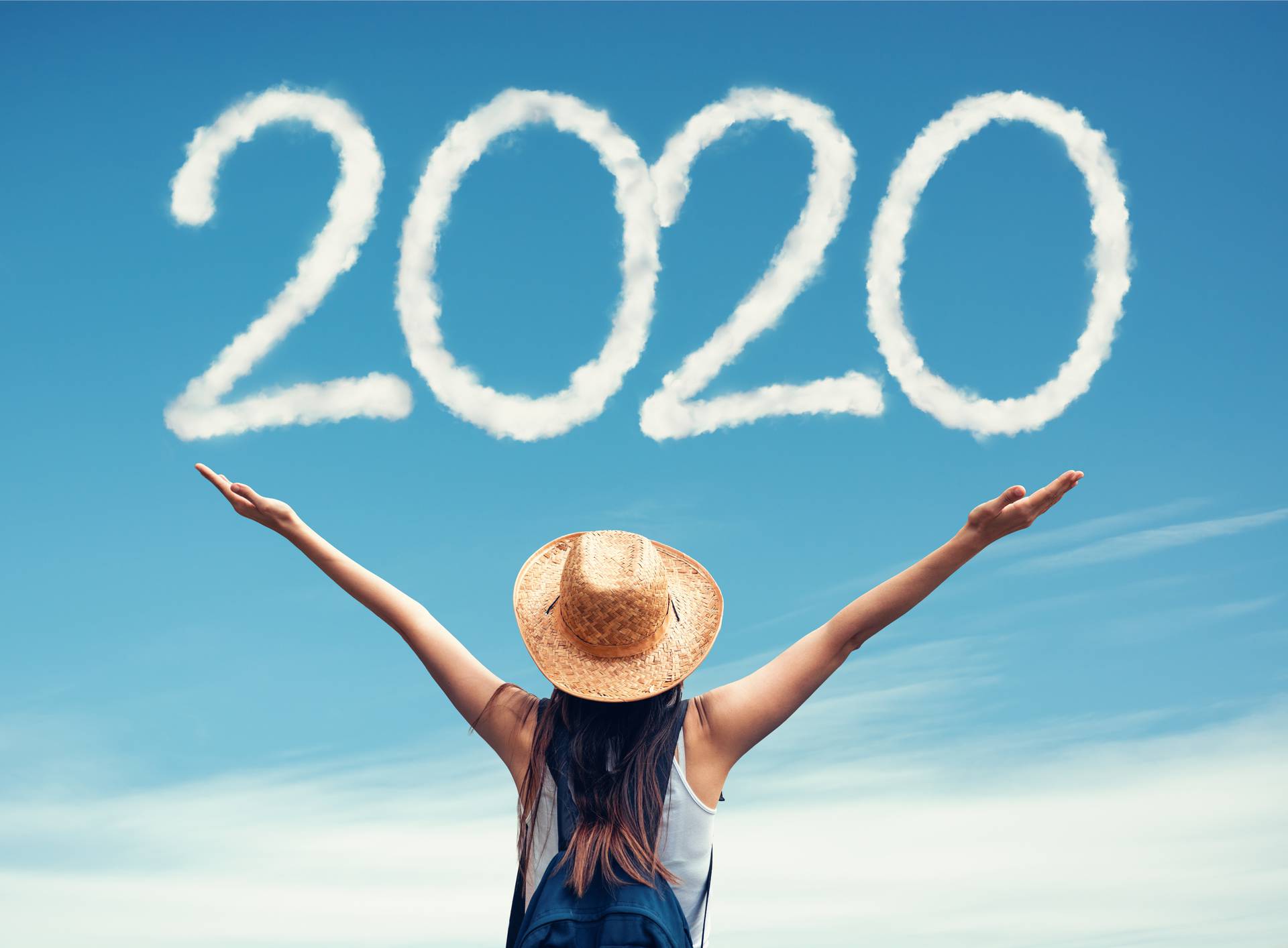 Beautiful woman greets the 2020 portrayaled with clouds