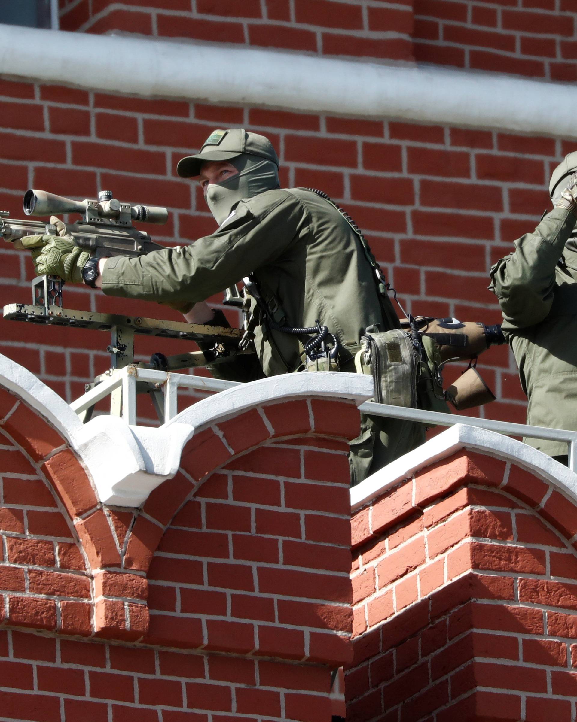 Snipers take up a position prior to the Victory Day parade at Red Square in Moscow