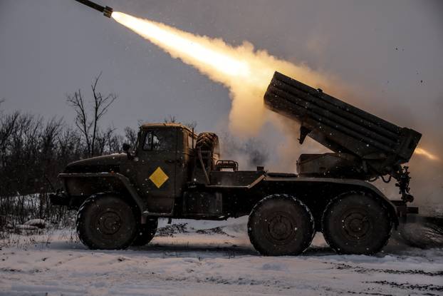 Ukrainian servicemen fire a Grad MLRS towards Russian troops near the frontline town of Chasiv Yar