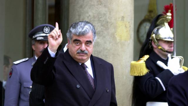 FILE PHOTO: Lebanese Prime Minister Rafik Hariri leaves the Elysee Palace following a meeting with French President Jacques Chirac in Paris