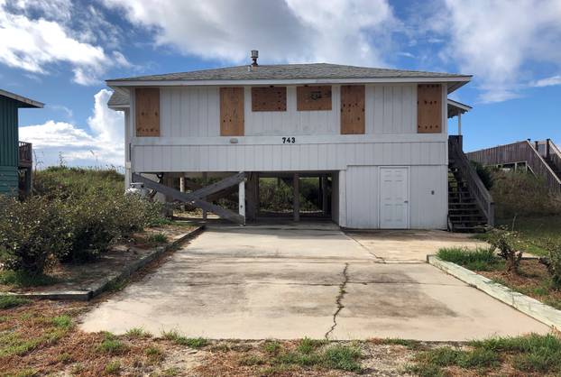 A beachfront home is boarded up ahead of Hurricane Florence, at Holden Beach
