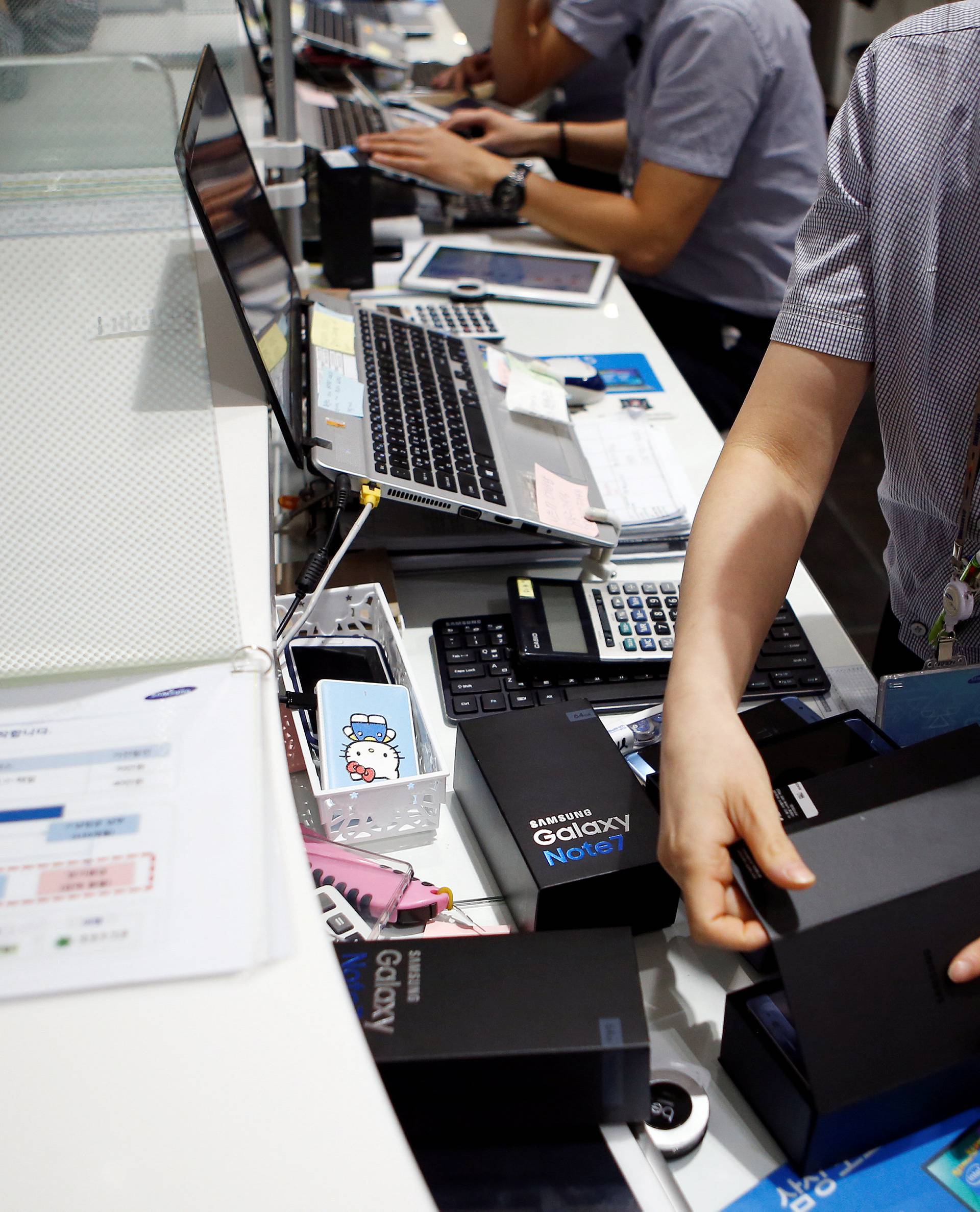 An employee checks exchanged Samsung Electronics' Galaxy Note 7 at company's headquarters in Seoul