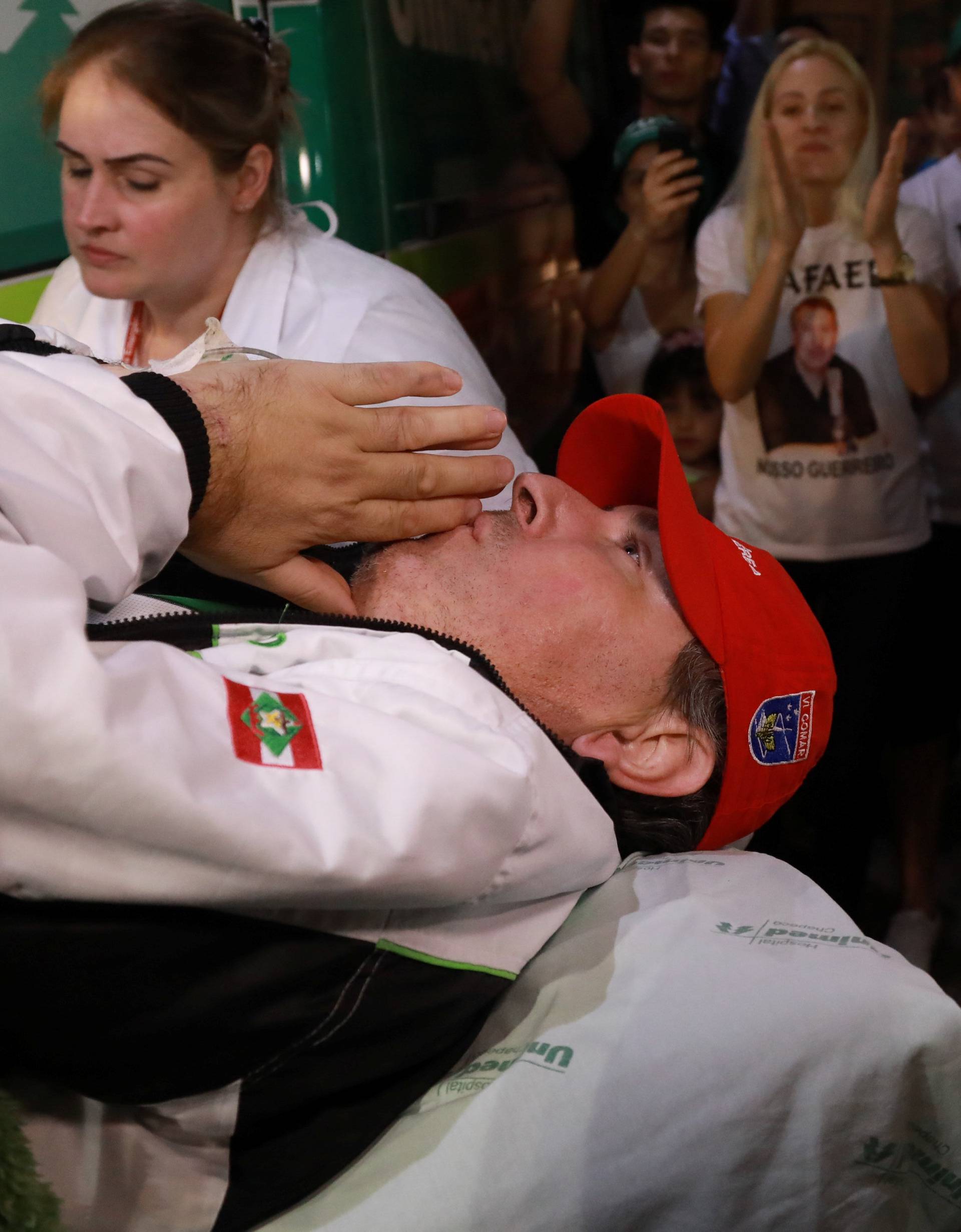 Brazilian radio journalist Rafael Henzel, lies on a stretcher as he arrives at the hospital in Brazil, after he survived a plane crash with Brazilian soccer team Chapecoense aboard, in Chapeco