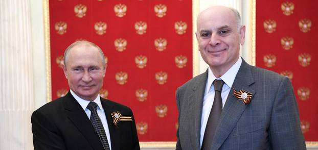 FILE PHOTO: Russian President Vladimir Putin greets leader of Georgian breakaway region of Abkhazia Aslan Bzhania