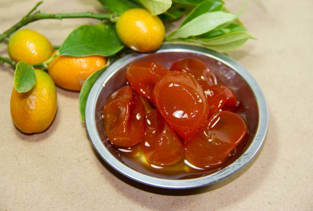 sweet of quinotos in syrup in the kitchen home