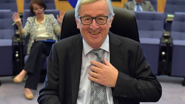 EC President Juncker gestures before a meeting of the College of Commissioners in Brussels