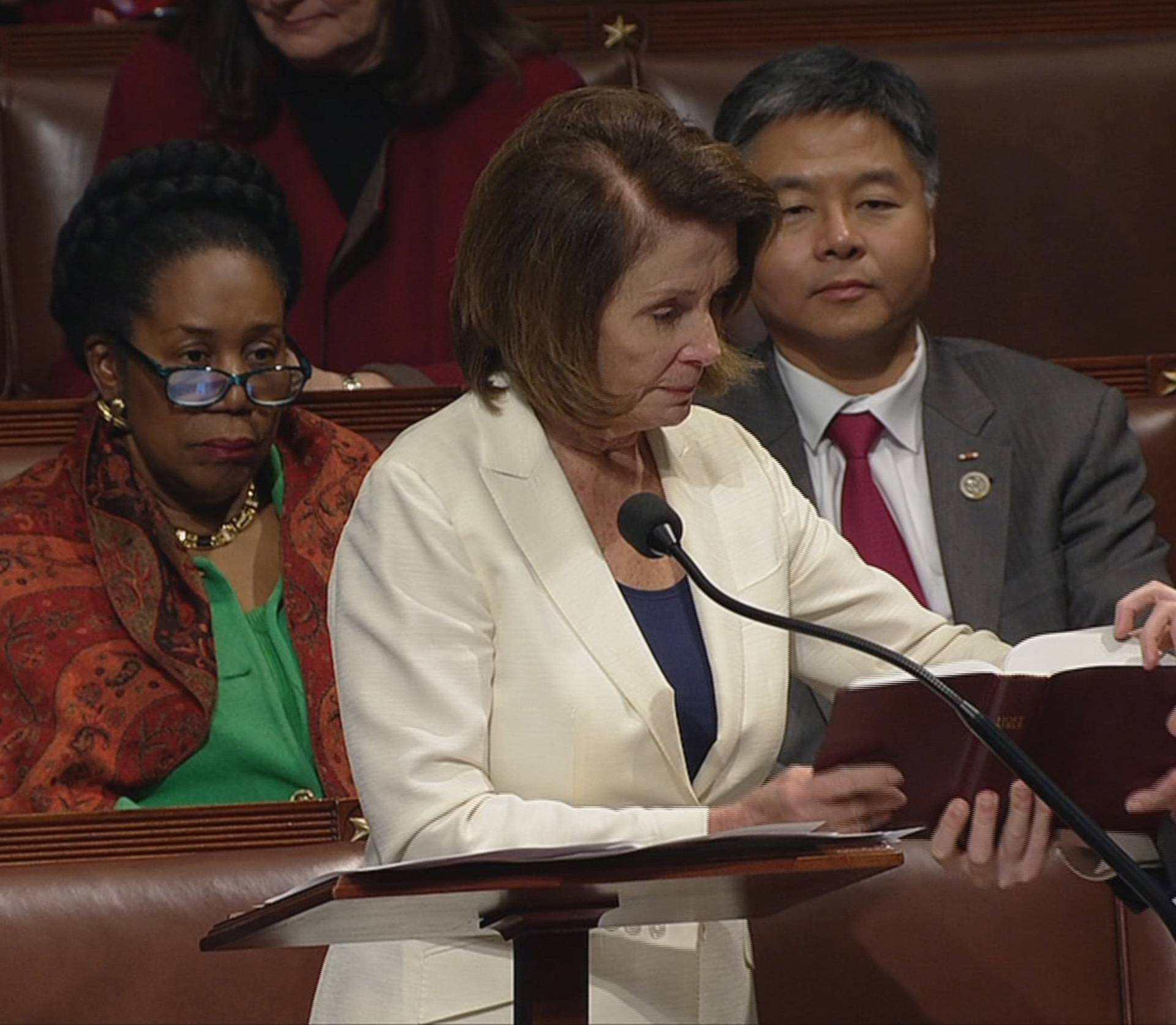 Video grab shows U.S. House Minority Leader Pelosi receiving bible during marathon speech on the floor of the House of Representatives on Capitol Hill in Washington