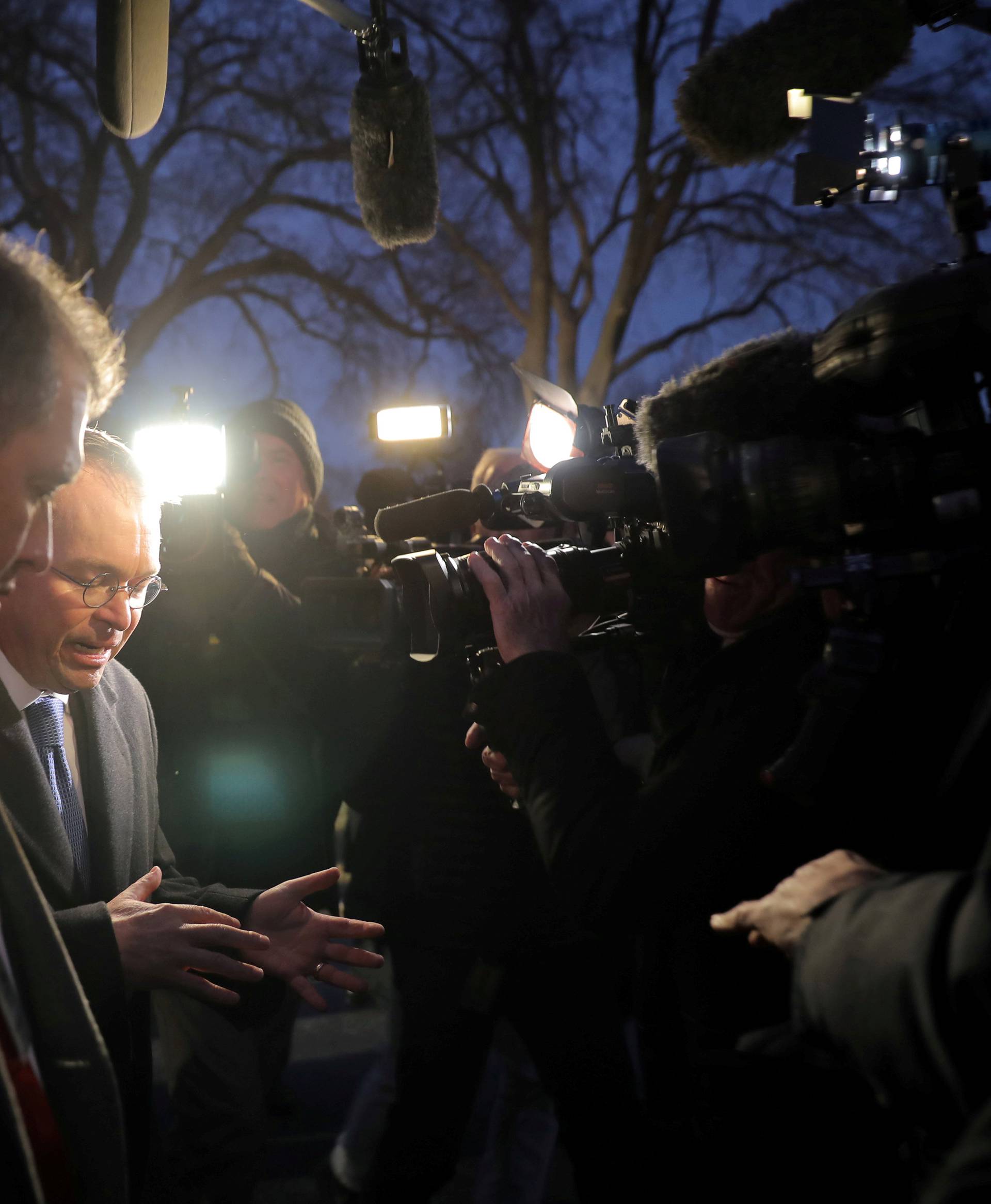 White House budget director Mick Mulvaney talks with reporters at the White House in Washington, U.S.