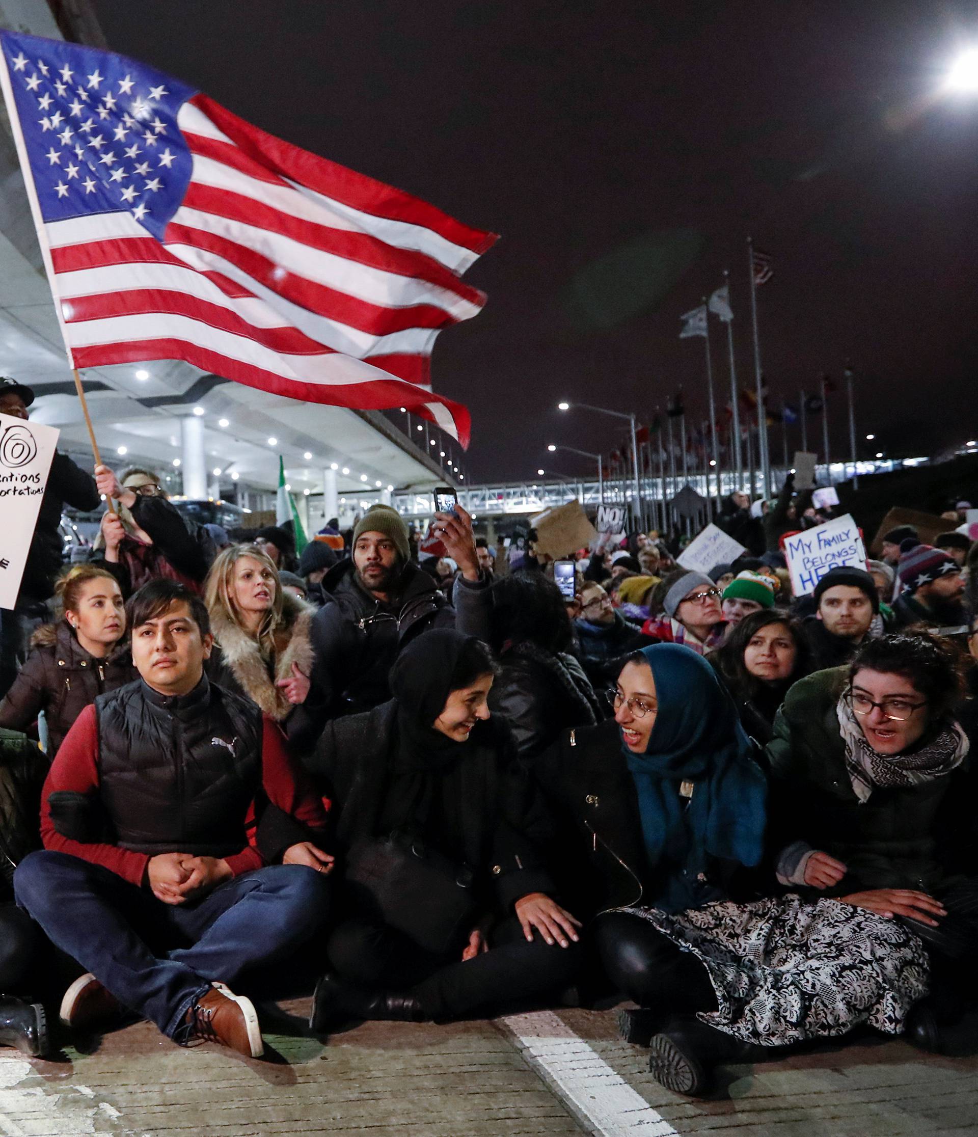 People gather to protest against the travel ban imposed by U.S. President Donald Trump's executive order, at O'Hare airport