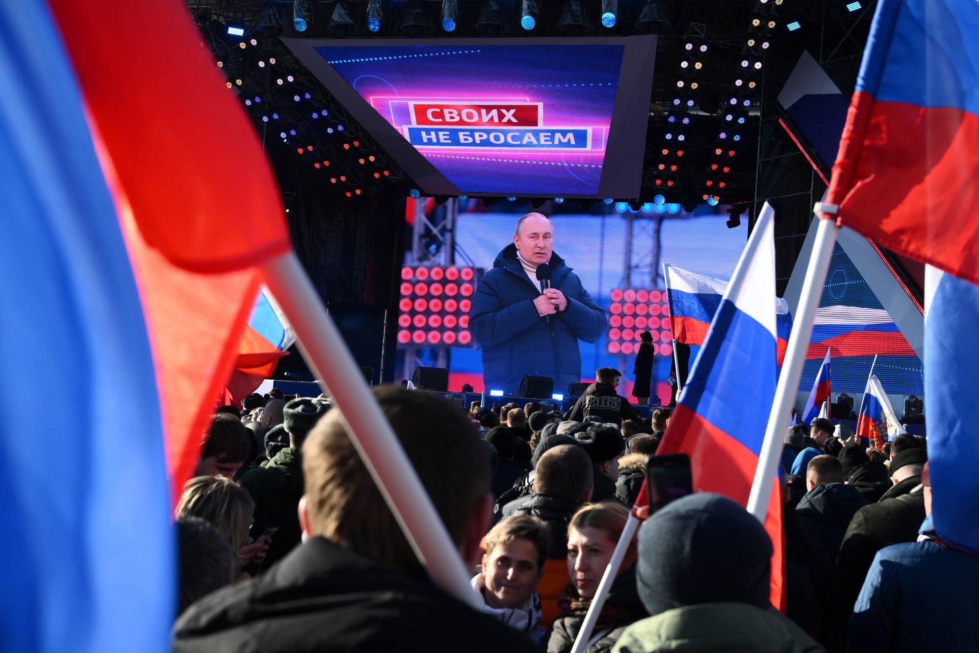 Russian President Vladimir Putin attends a concert marking the eighth anniversary of Russia's annexation of Crimea in Moscow